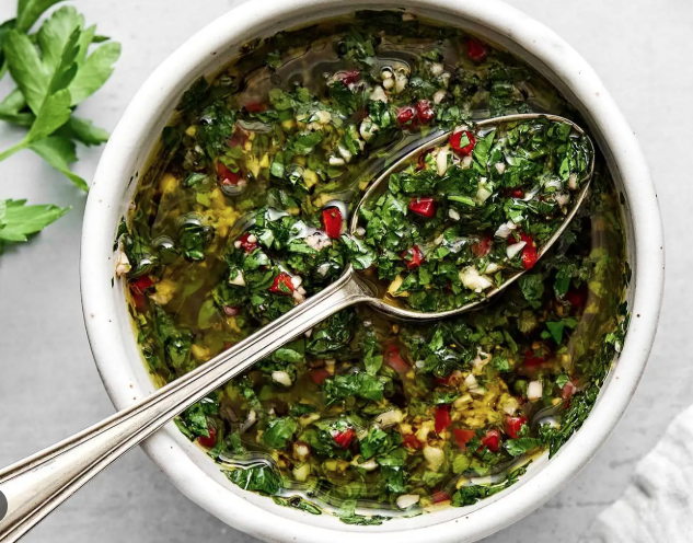 Homemade chimichurri sauce made with fresh parsley, garlic, olive oil and lemon